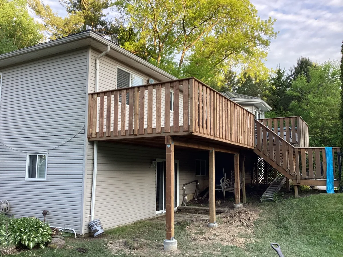 Elevated cedar deck with stairs on residential home